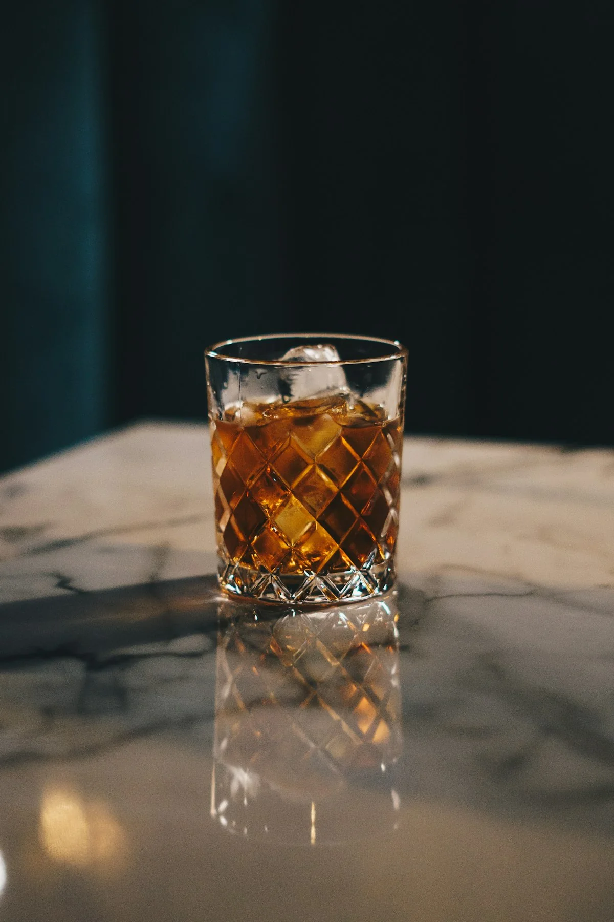 Old fashioned in a sturdy cut rocks glass.