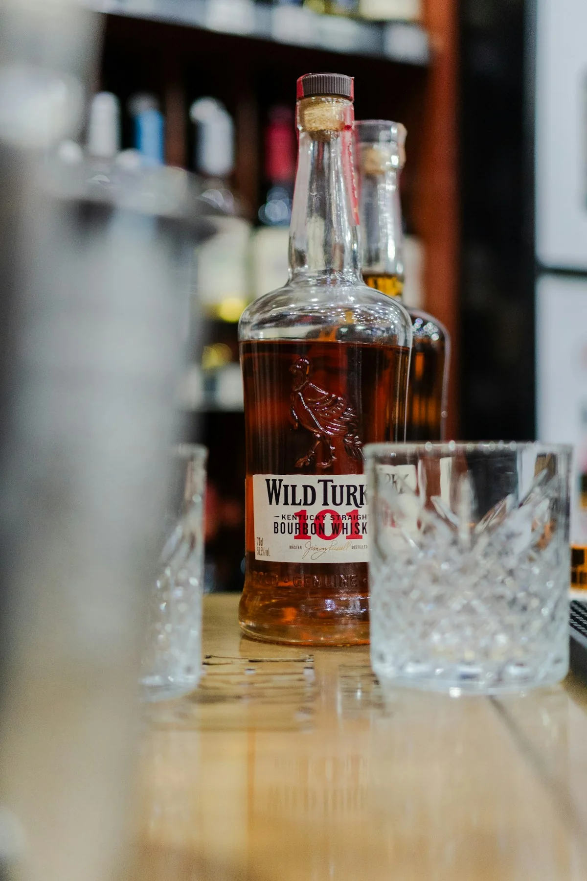 Clean stemware on a quiet bar — drinks made for clarity